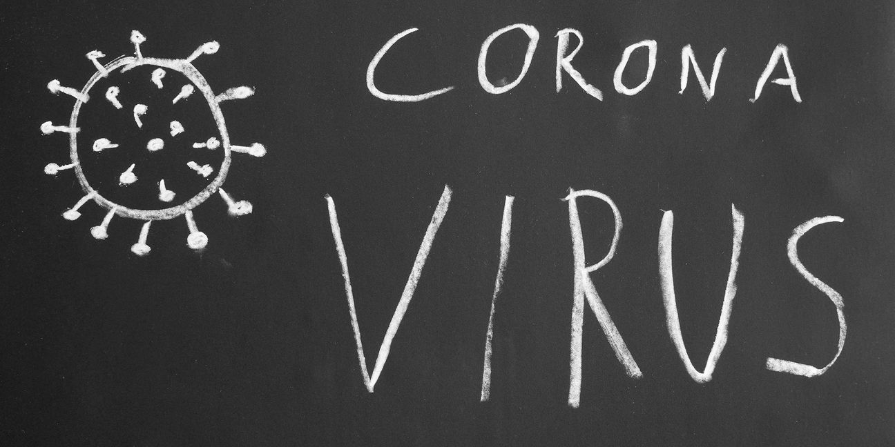 Corona virus hand-drawn text and simple illustration with chalk on blackboard
 319418800