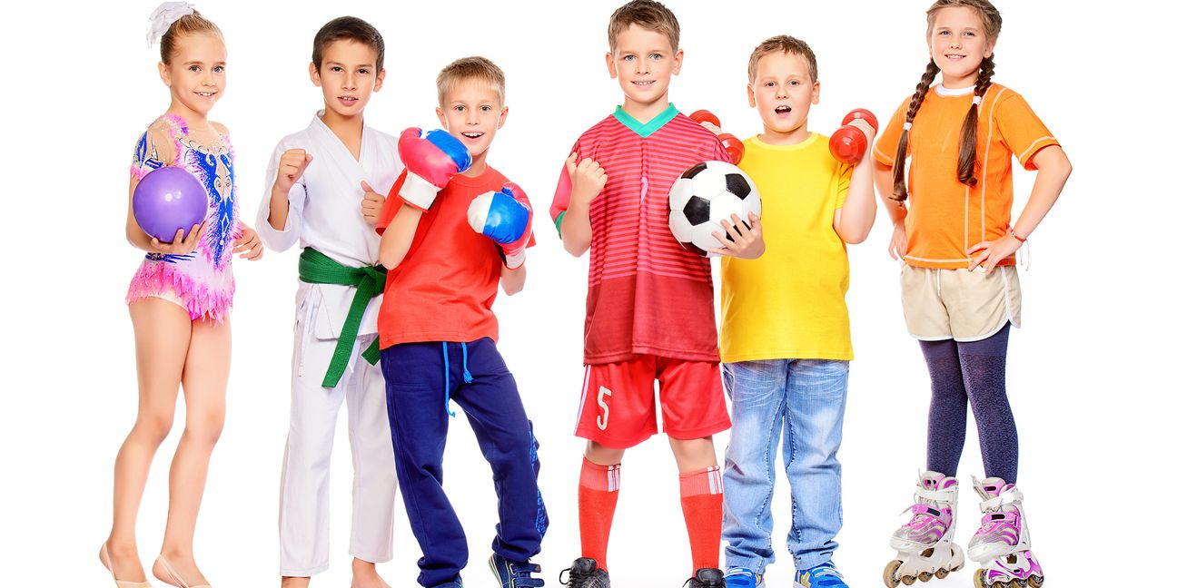 Sports and activities for children. Group of joyful boys and a girls engaged in various sports posing together. Education. Isolated over white background.